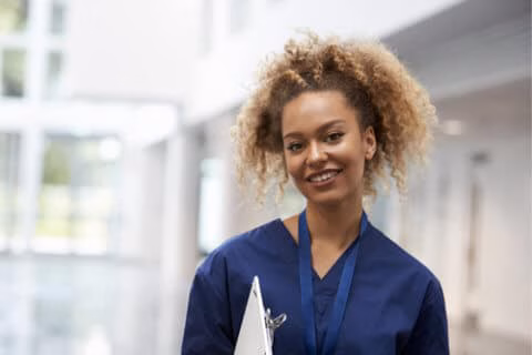 A doctor holding a clipboard representing employment on the journey of life